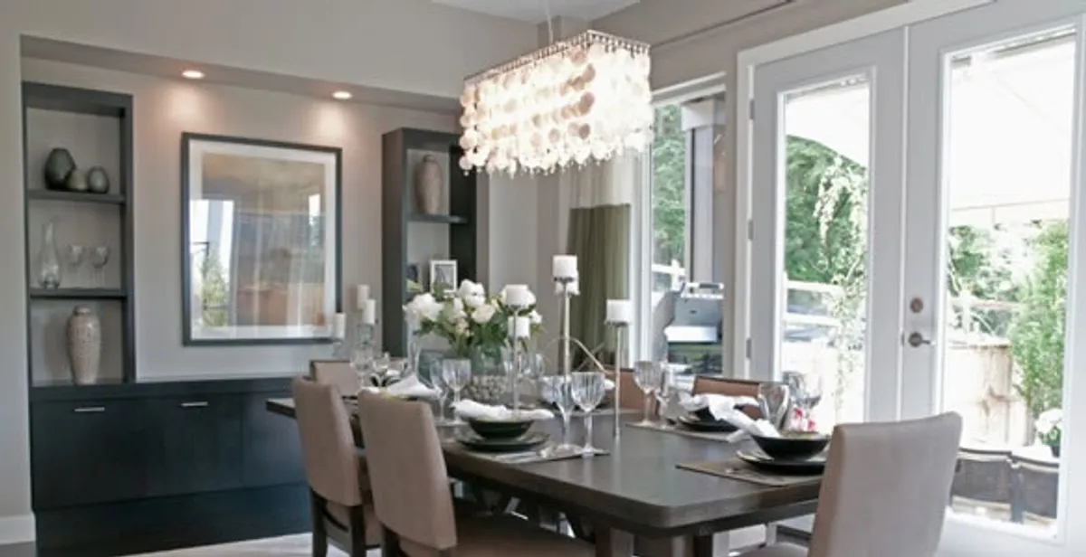 Elegant dining room chandelier installation above table in Scottsdale, AZ