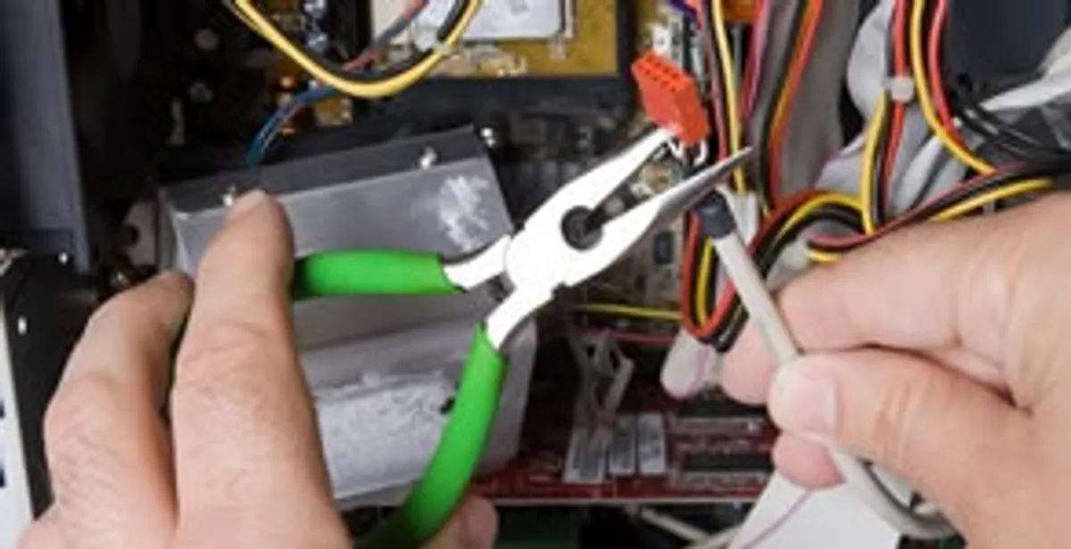 Licensed electrical contractor performing electrical repair with tools in Gilbert, AZ