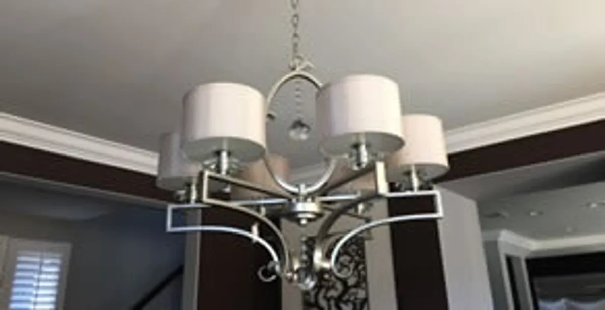 Modern chandelier installation with multiple light fixtures in Scottsdale, AZ